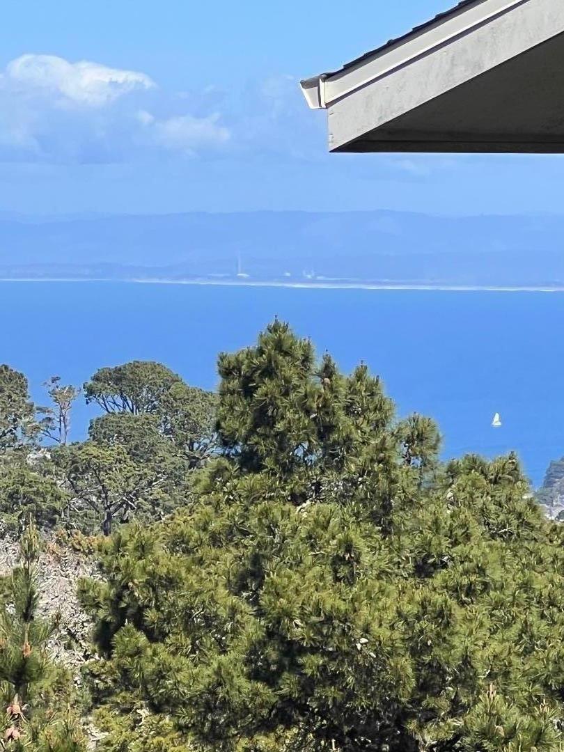 4 Shepherds Knoll Road Monterey, CA 93940 - Photo 1 of 1 a view of a large building with a mountain in the background