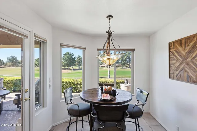 a view of a dining room with furniture window and outside view
