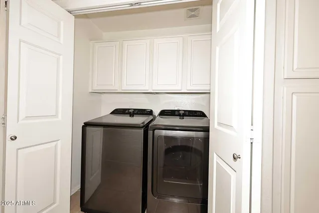a utility room with dryer and washer