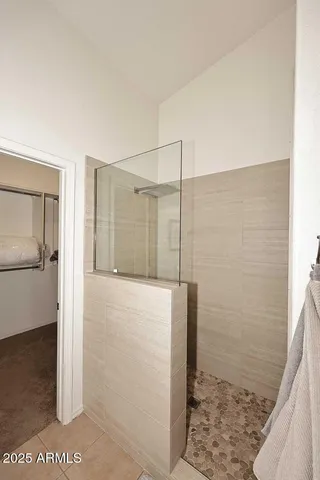 a bathroom with a shower and a sink