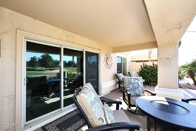 a view of a dining room with furniture window and outside view