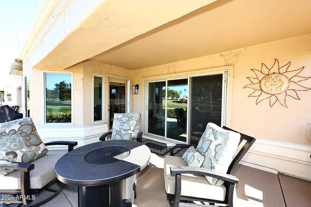 a living room with furniture and a window