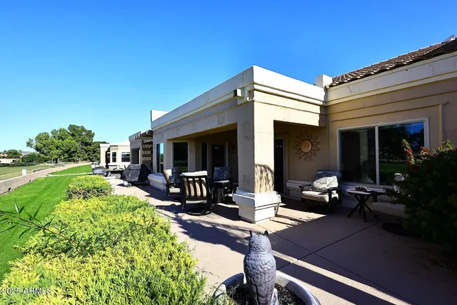 a view of a house with backyard porch and patio