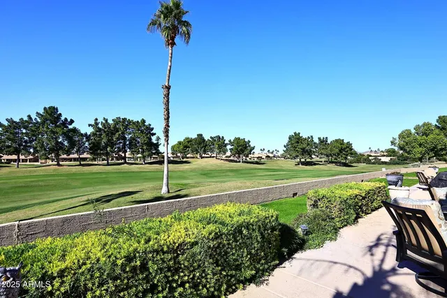 a view of a golf course with a lake view
