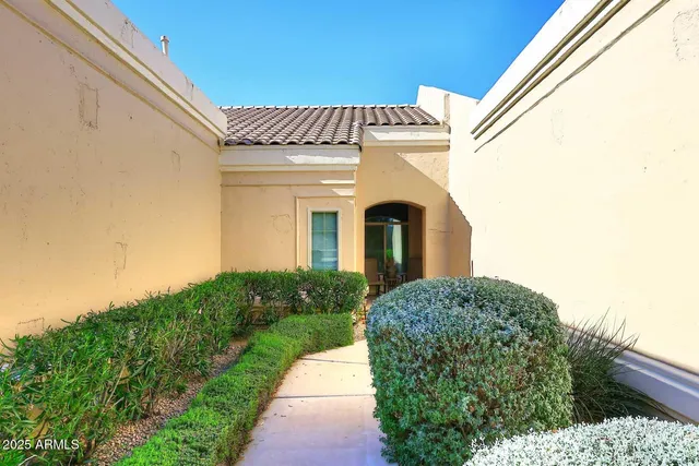 a view of a house with a small yard
