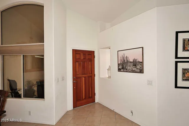 a view of a hallway with paintings on the wall