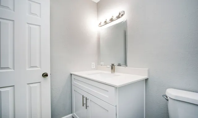 a white toilet and shower