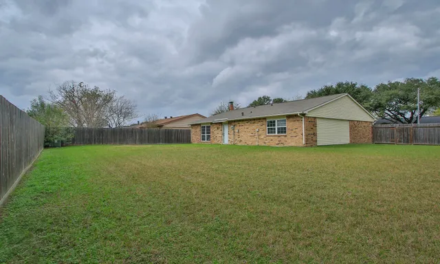 a house view with garden space