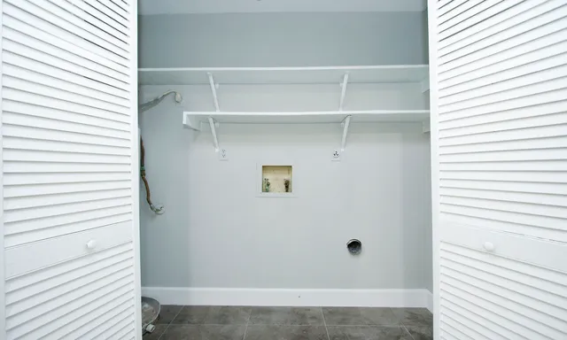 a kitchen with a sink a stove and cabinets