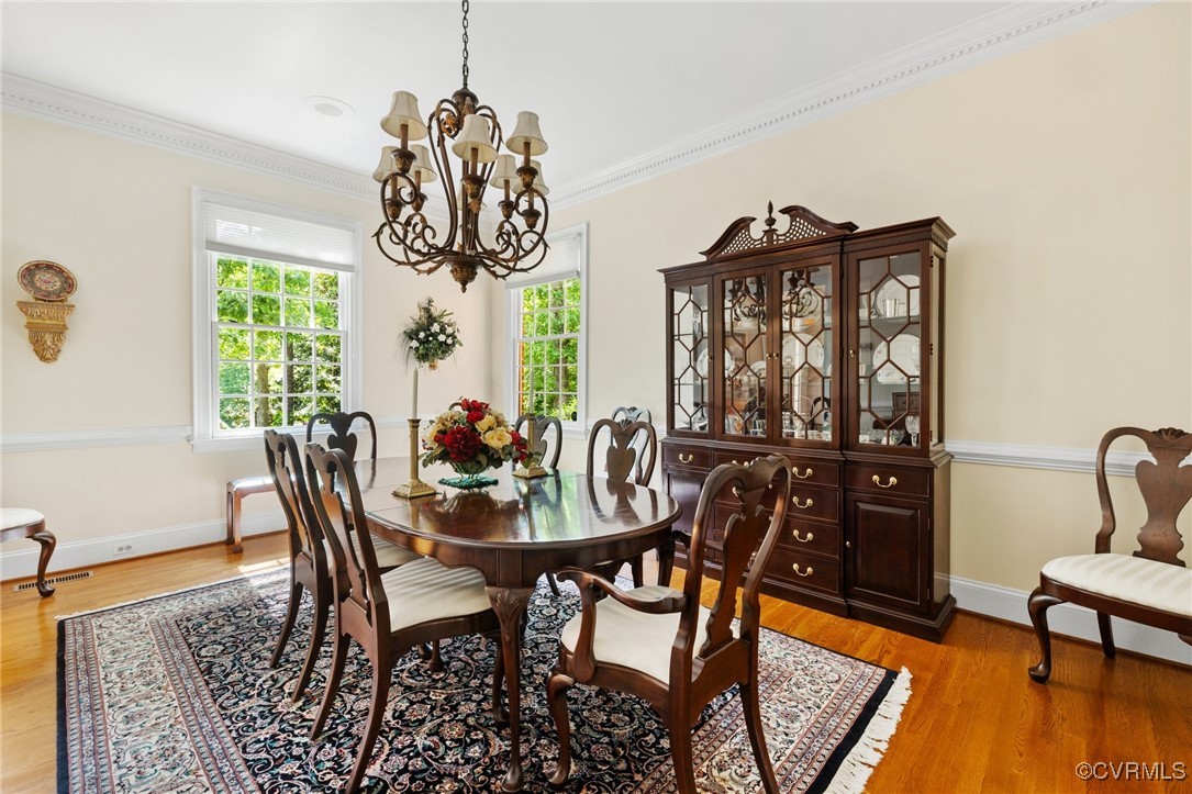 3831 Reeds Landing Circle Midlothian, VA 23113 - Photo 18 of 50 a view of a dining room with furniture window and wooden floor