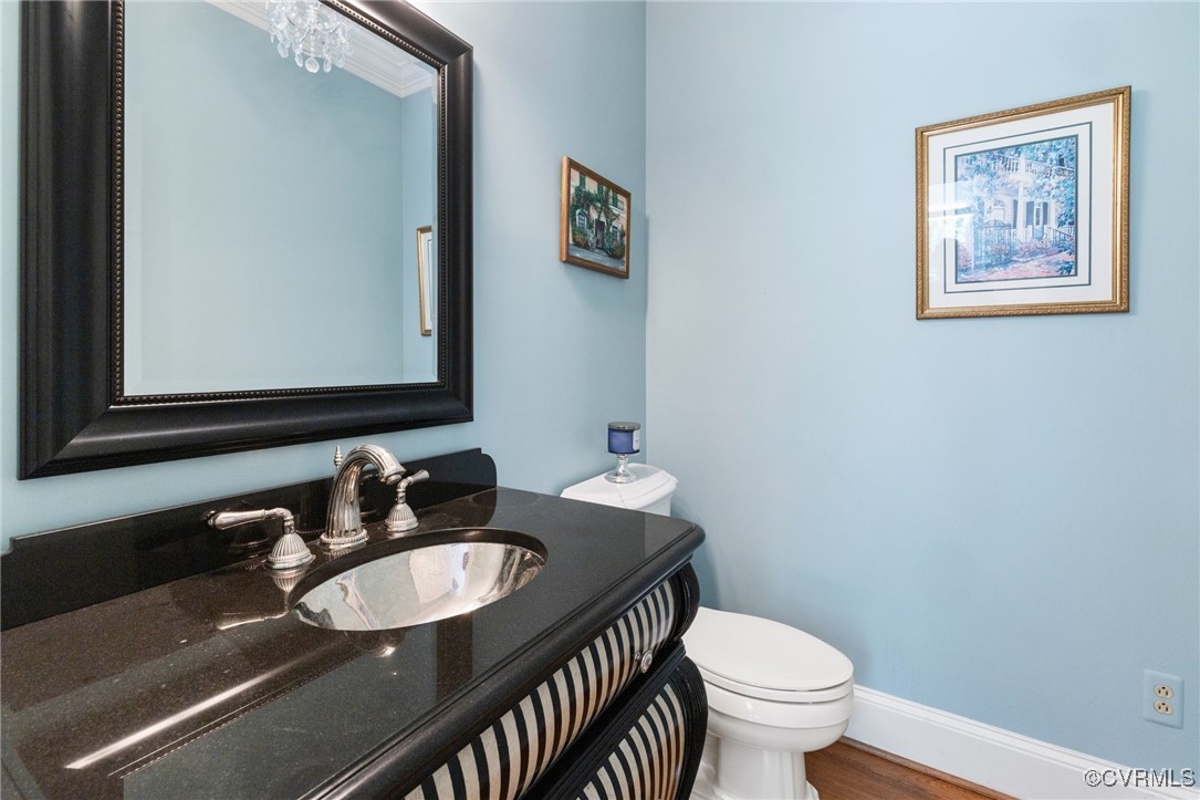 3831 Reeds Landing Circle Midlothian, VA 23113 - Photo 21 of 50 a bathroom with a granite countertop toilet a sink and a mirror