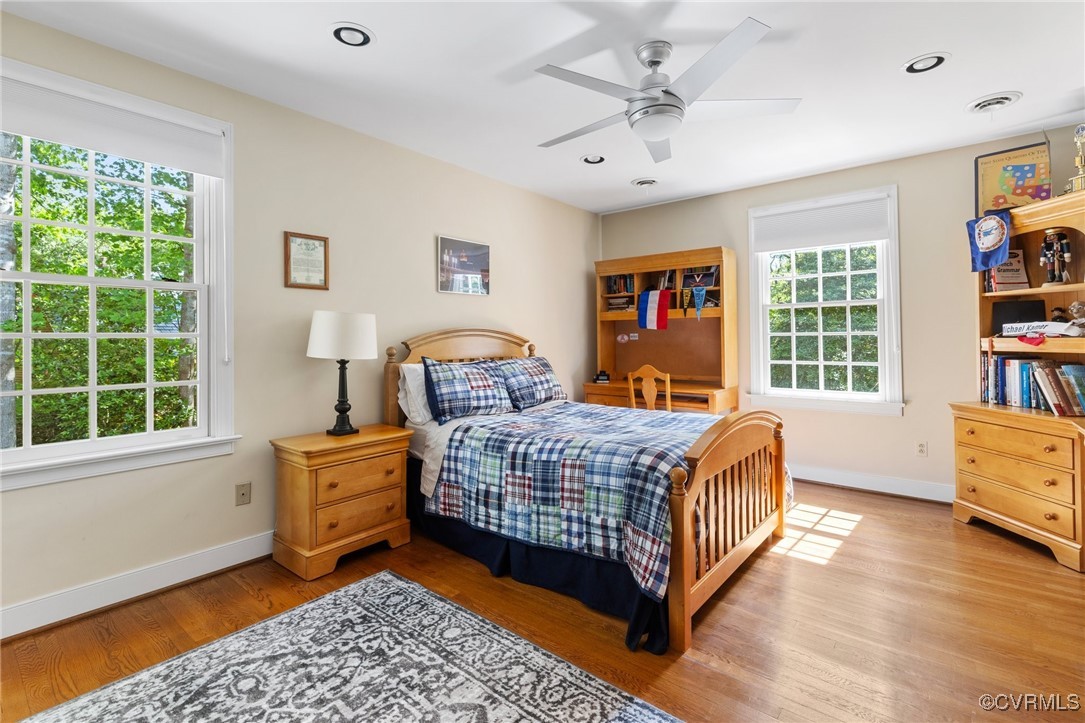 3831 Reeds Landing Circle Midlothian, VA 23113 - Photo 24 of 50 a bedroom with a bed and wooden floor