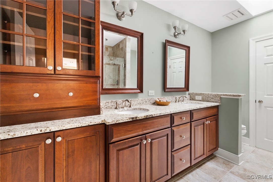 3831 Reeds Landing Circle Midlothian, VA 23113 - Photo 25 of 50 a bathroom with a sink and a large mirror