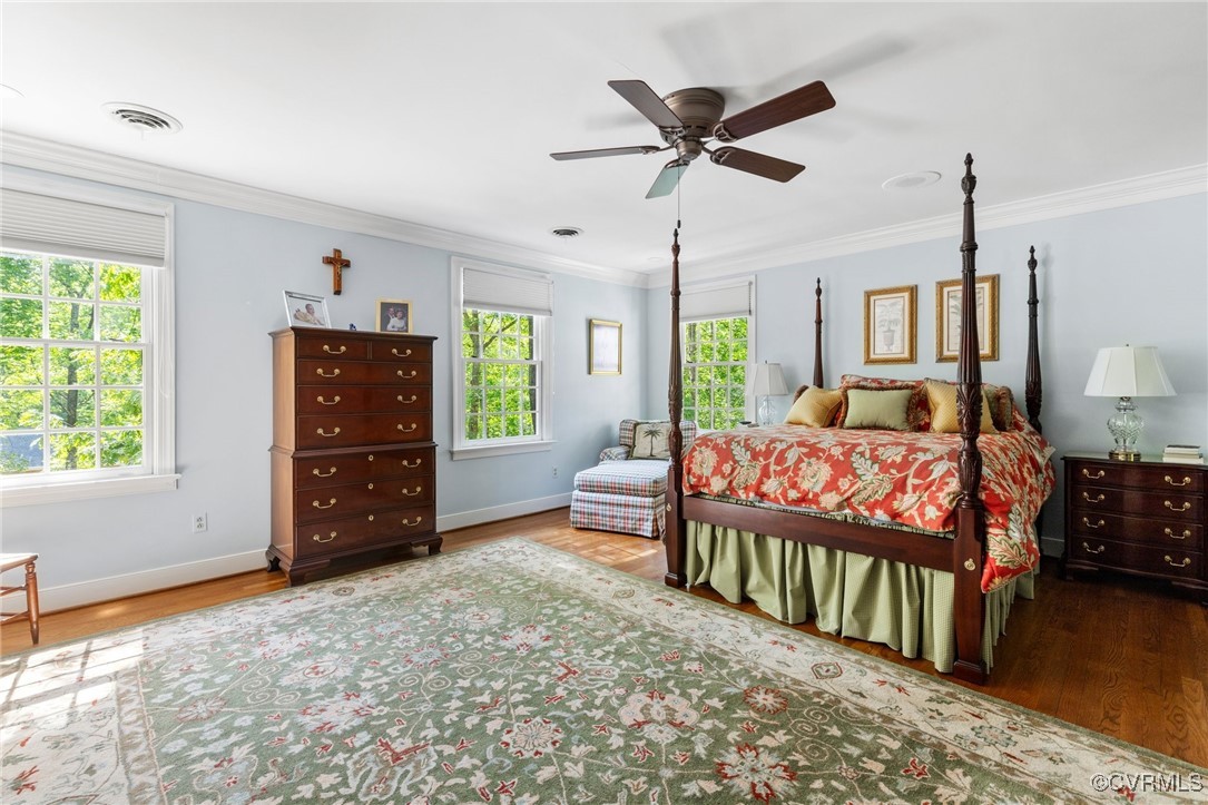 3831 Reeds Landing Circle Midlothian, VA 23113 - Photo 29 of 50 a bedroom with a bed window and a chandelier