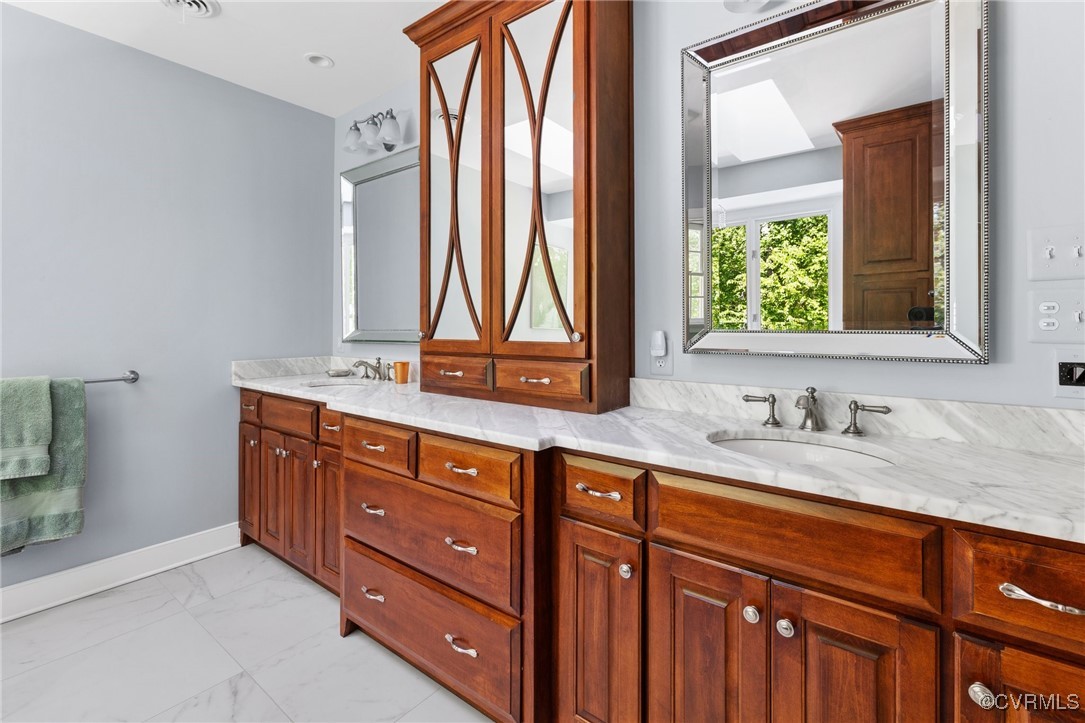 3831 Reeds Landing Circle Midlothian, VA 23113 - Photo 32 of 50 a bathroom with a granite countertop sink and a large mirror next to a window