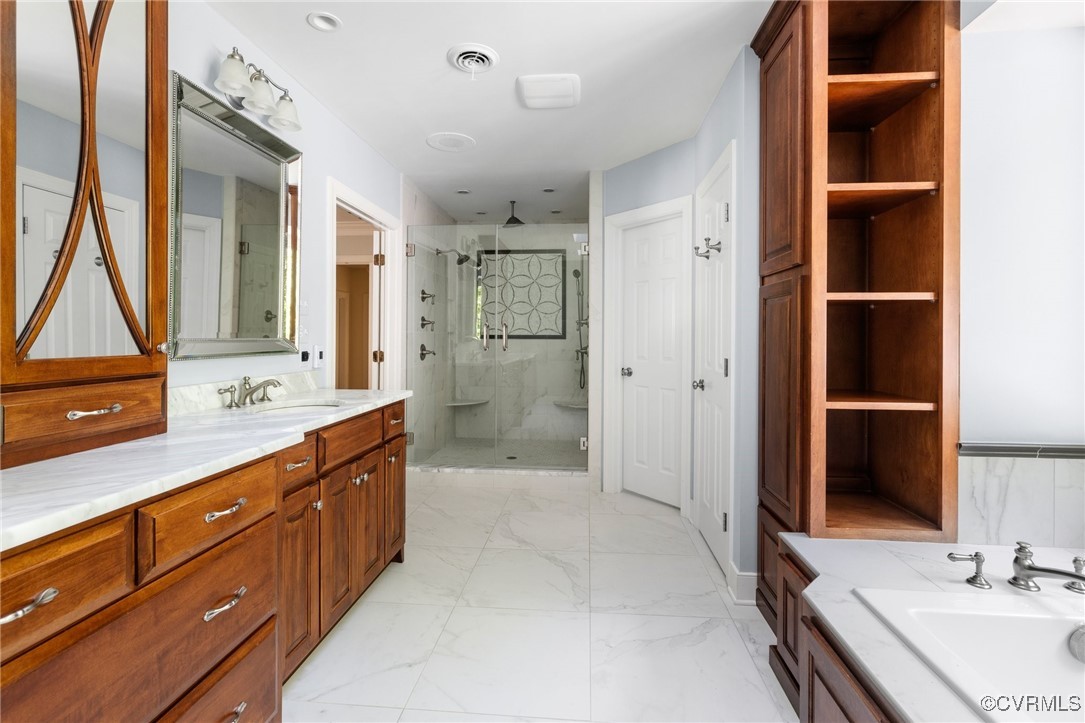 3831 Reeds Landing Circle Midlothian, VA 23113 - Photo 33 of 50 a bathroom with a double vanity sink a mirror and a shower