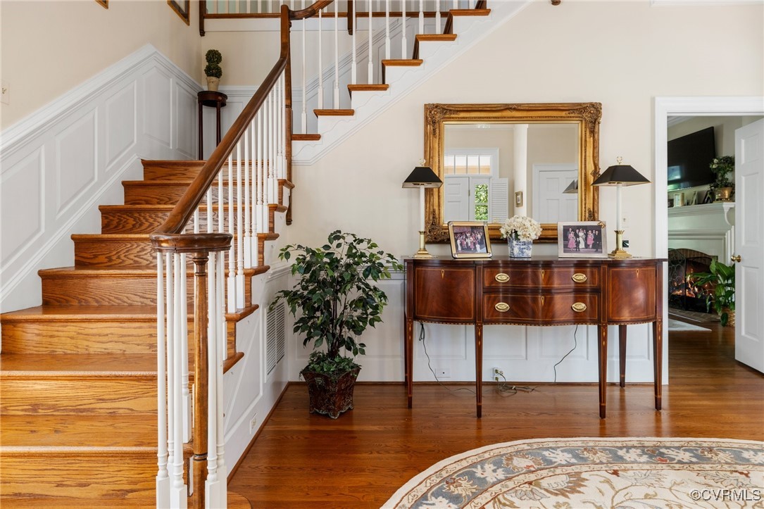 3831 Reeds Landing Circle Midlothian, VA 23113 - Photo 5 of 50 a view of a hallway with wooden floor and staircase