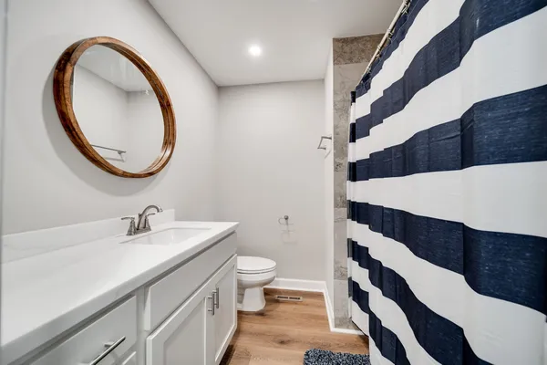 a bathroom with a sink and a mirror