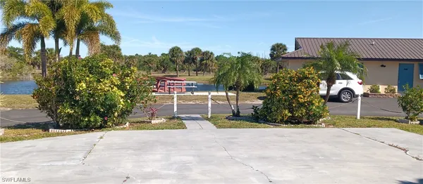 a view of a chairs in front of a house