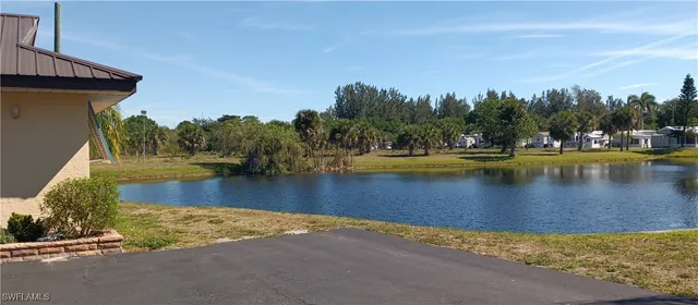 a view of a swimming pool with an outdoor space and seating area