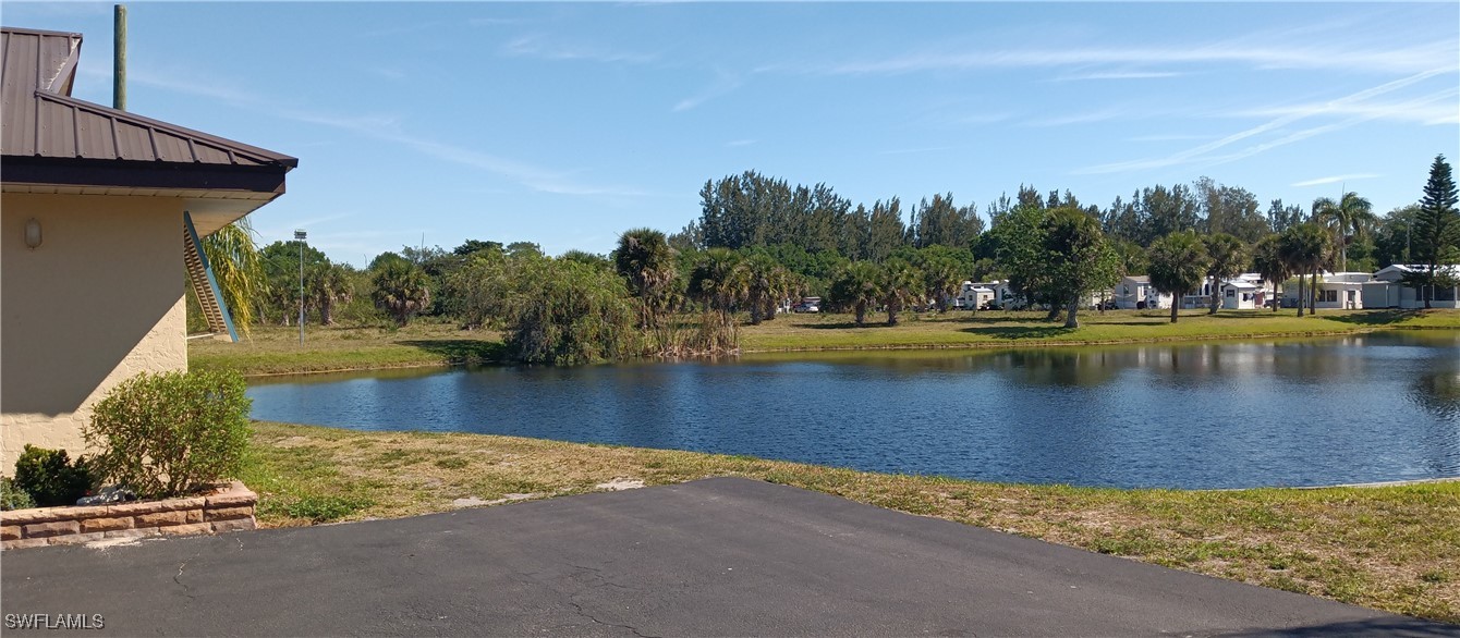 1159 Daniels Road Moore Haven, FL 33471 - Photo 11 of 21 a view of a swimming pool with an outdoor space and seating area