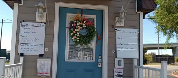 a front view of a house with a potted plant