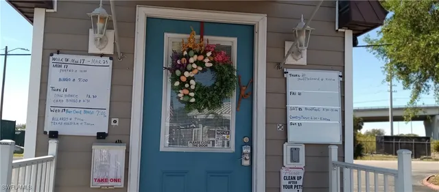 a front view of a house with a potted plant