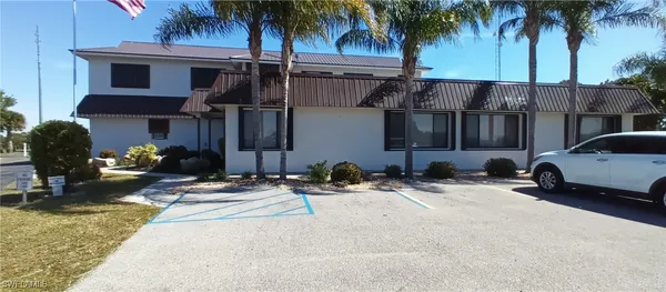 a view of a car parked in front of a house