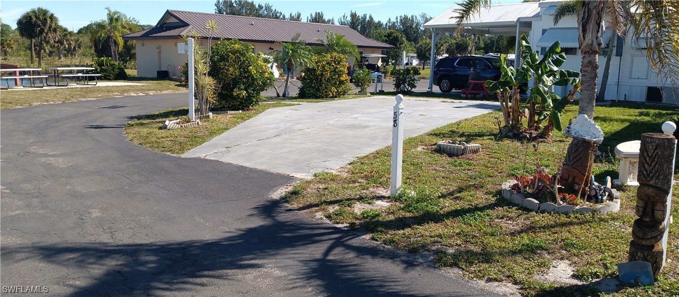 1159 Daniels Road Moore Haven, FL 33471 - Photo 2 of 21 a view of a yard with plants