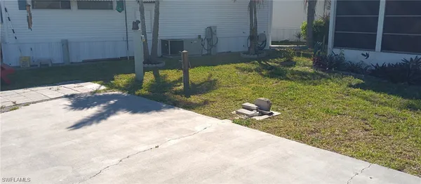 a view of a backyard of the house