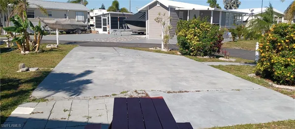 a view of yard with large trees