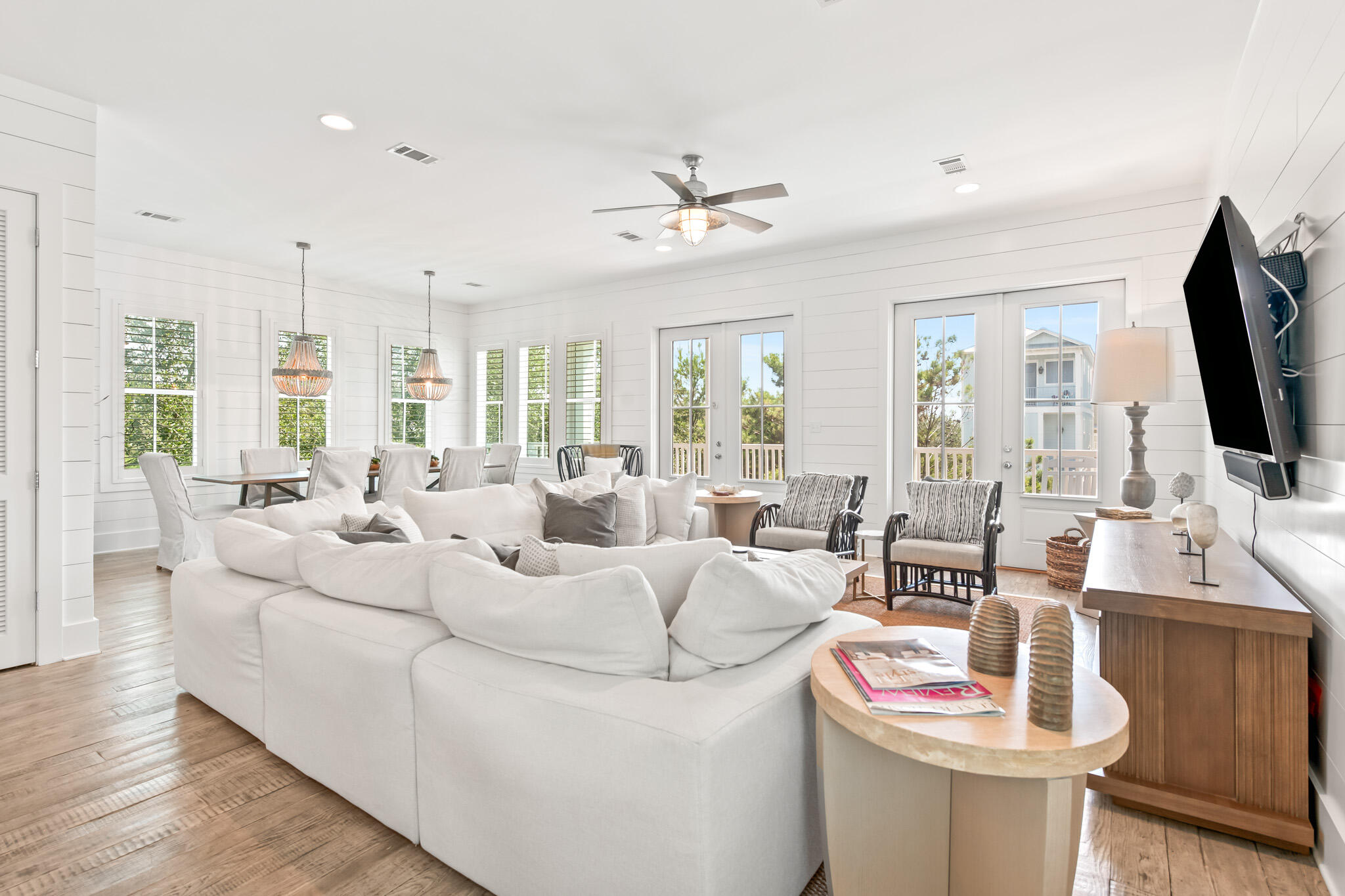 11 Pompano Pl Inlet Beach Inlet Beach, FL 32461 - Photo 38 of 68 a living room with furniture a flat screen tv and a large window
