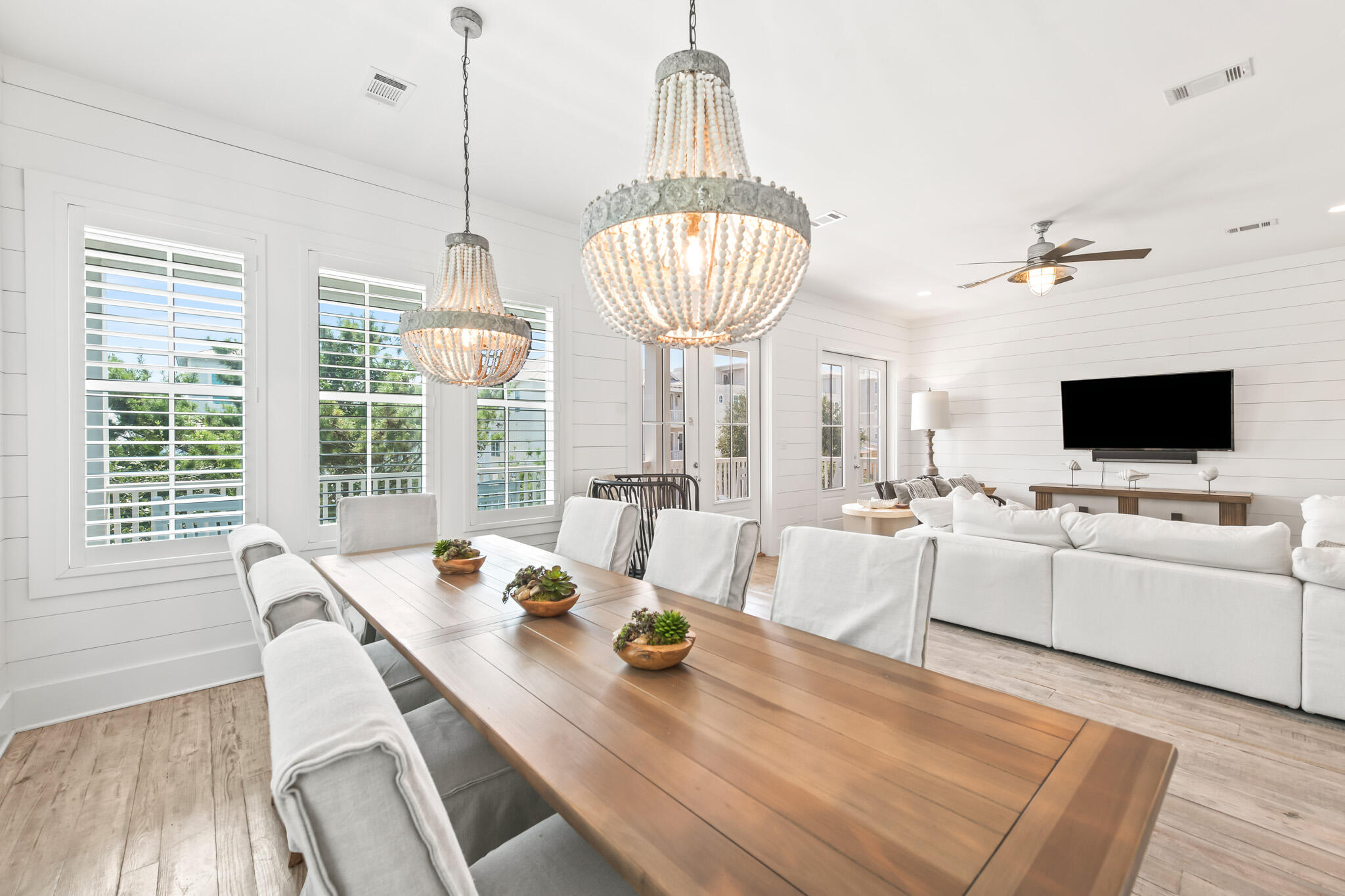 11 Pompano Pl Inlet Beach Inlet Beach, FL 32461 - Photo 39 of 68 a view of a dining room with furniture a chandelier and wooden floor