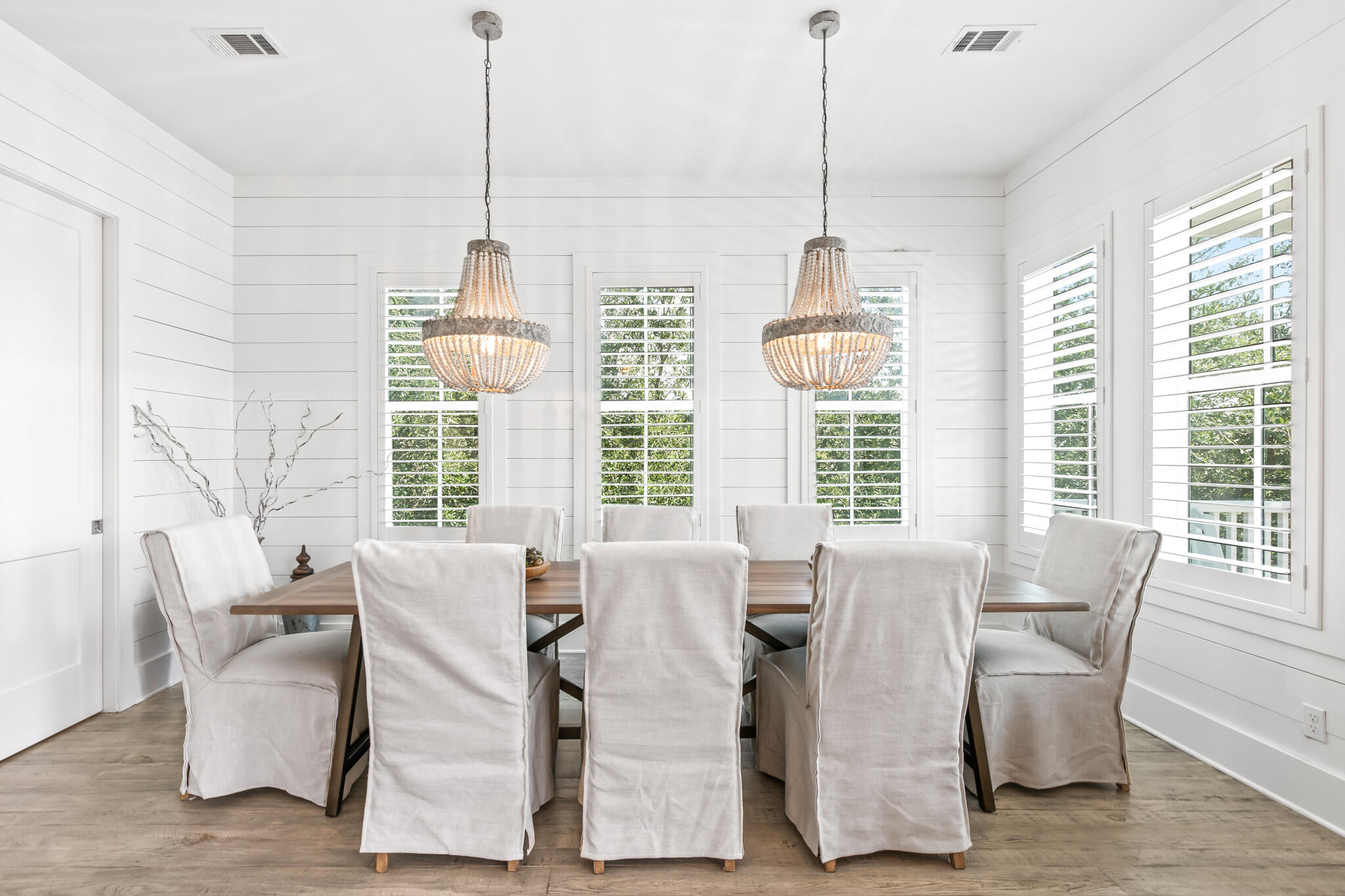 11 Pompano Pl Inlet Beach Inlet Beach, FL 32461 - Photo 40 of 68 a dining room with furniture a chandelier and wooden floor