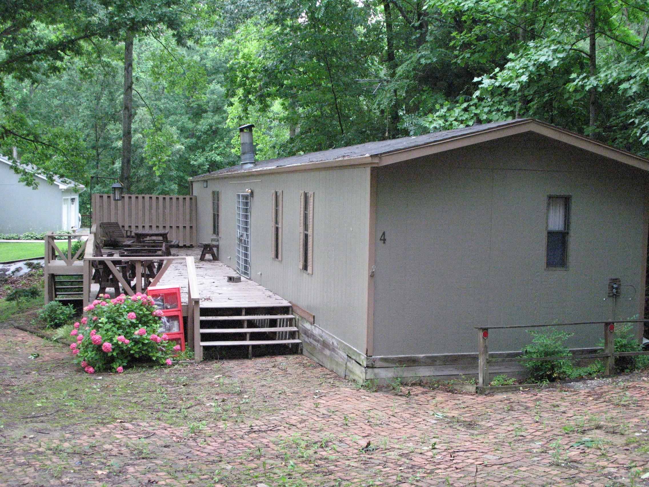 4 Oak Ridge Road Union Hall, VA 24176 - Photo 2 of 20 a backyard of a house with a yard and garage