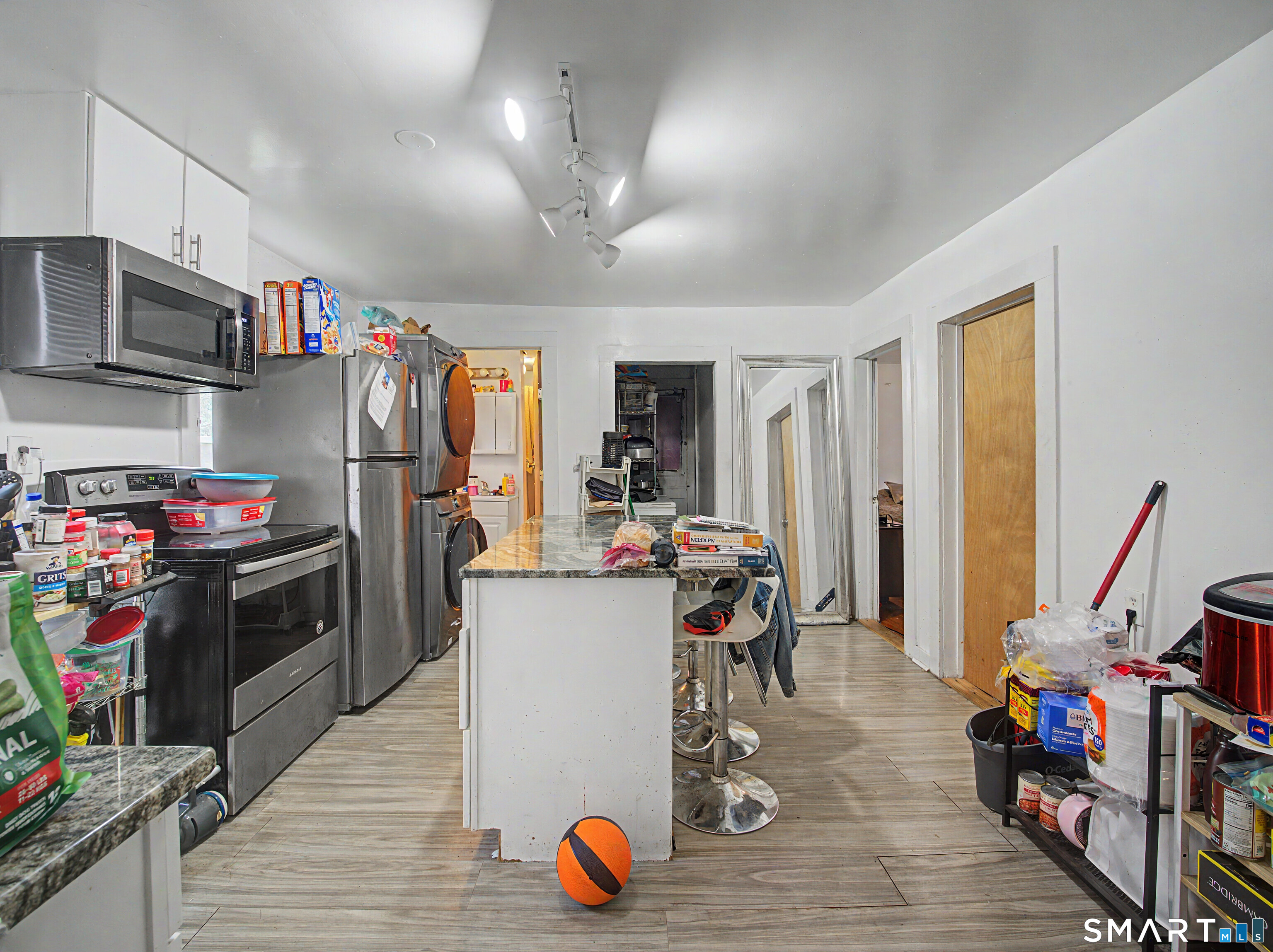 319 Carroll Avenue Bridgeport, CT 06607 - Photo 22 of 40 a view of a kitchen with fridge and workspace
