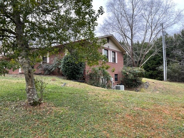937 County Road 181 Decatur, TN 37322 - Photo 17 of 52 a view of a yard in front of a house with large trees