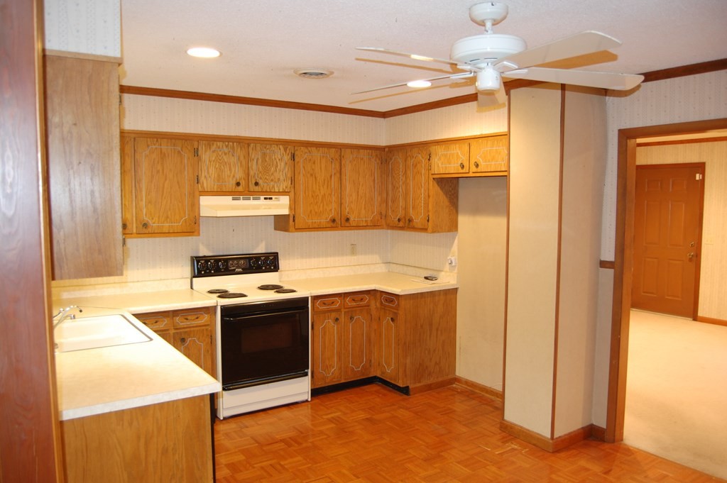 937 County Road 181 Decatur, TN 37322 - Photo 24 of 52 a kitchen with a stove a refrigerator and a sink