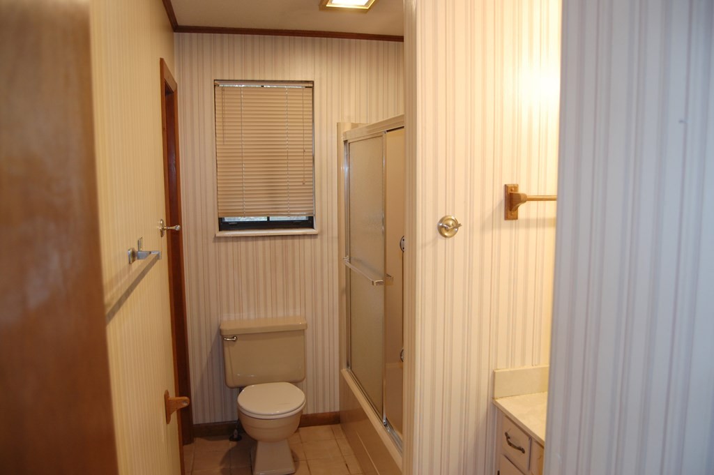 937 County Road 181 Decatur, TN 37322 - Photo 32 of 52 a bathroom with a toilet and a shower