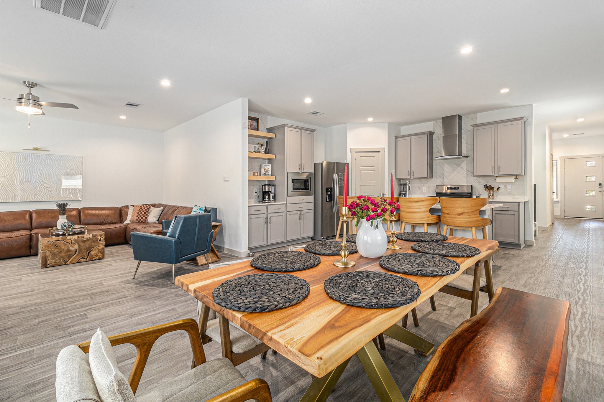 a living room with furniture kitchen view and a table