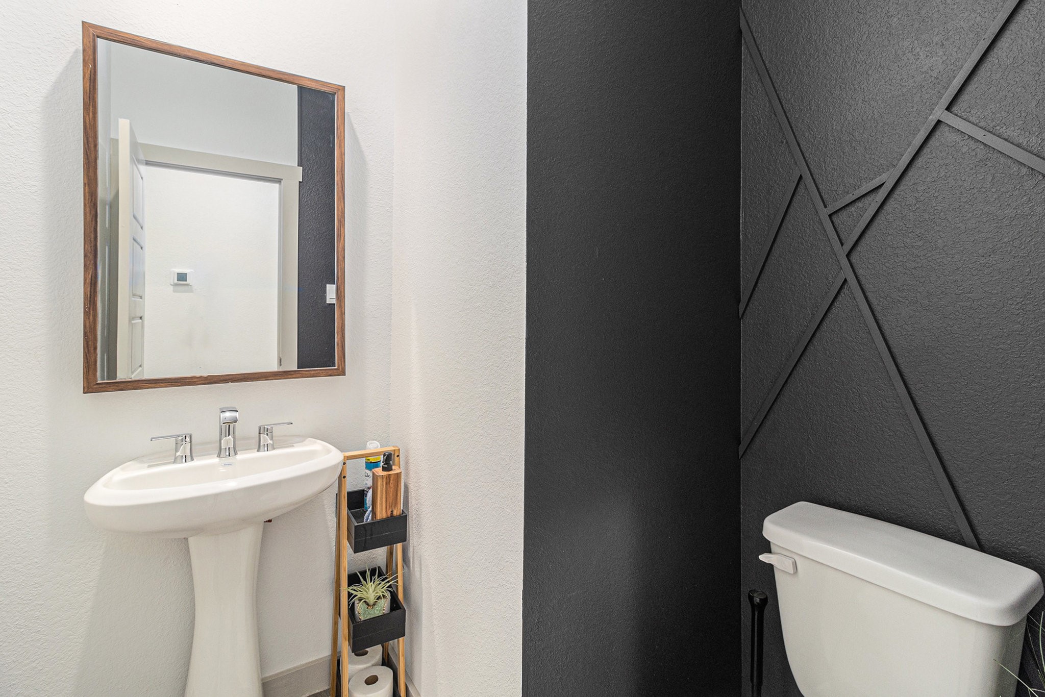 12823 Tokenhouse Lane Houston, TX 77047 - Photo 14 of 37 a bathroom with a sink toilet and mirror