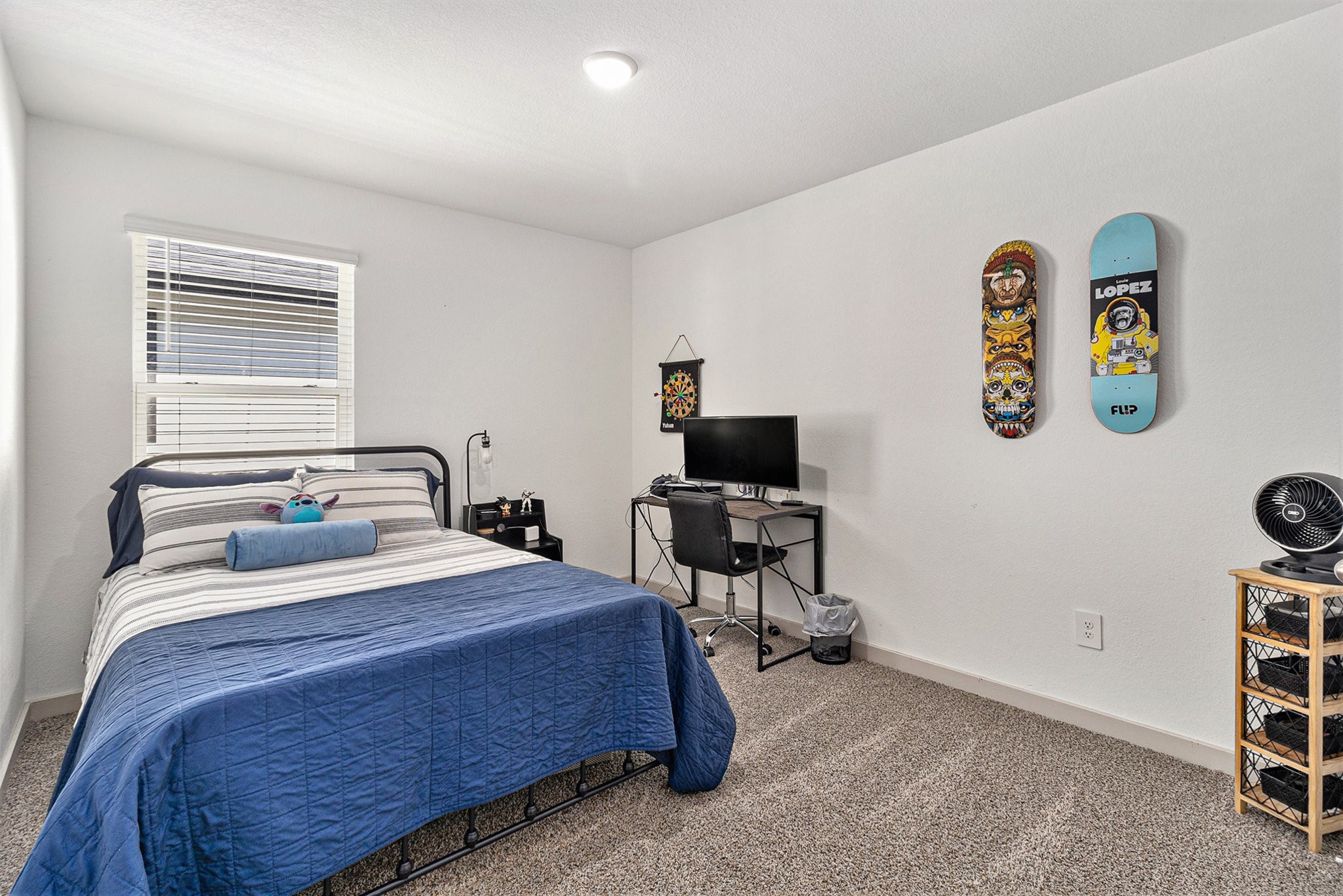 12823 Tokenhouse Lane Houston, TX 77047 - Photo 22 of 37 a bedroom with a bed and a chair