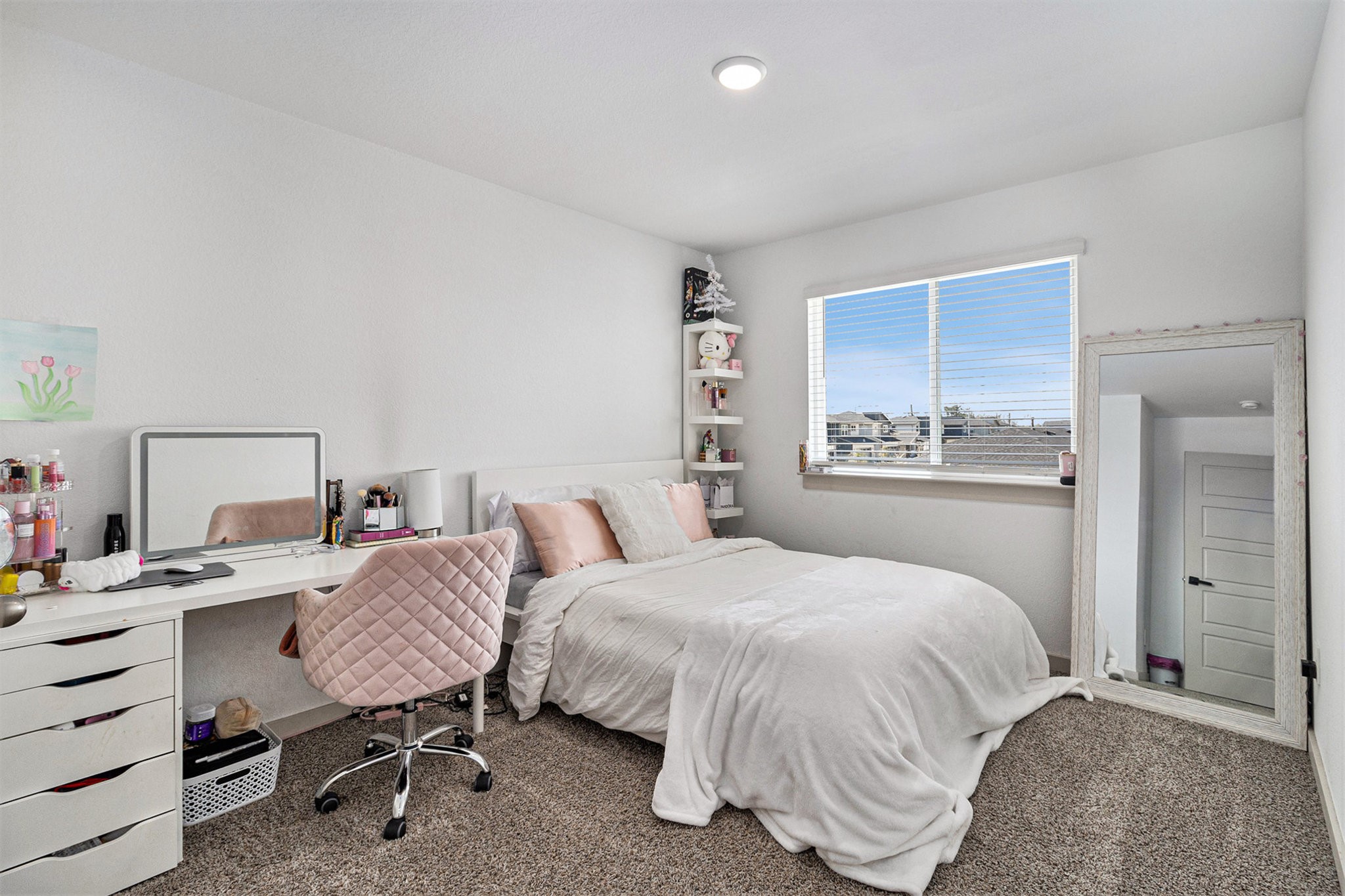12823 Tokenhouse Lane Houston, TX 77047 - Photo 24 of 37 a bedroom with a bed a desk and chair