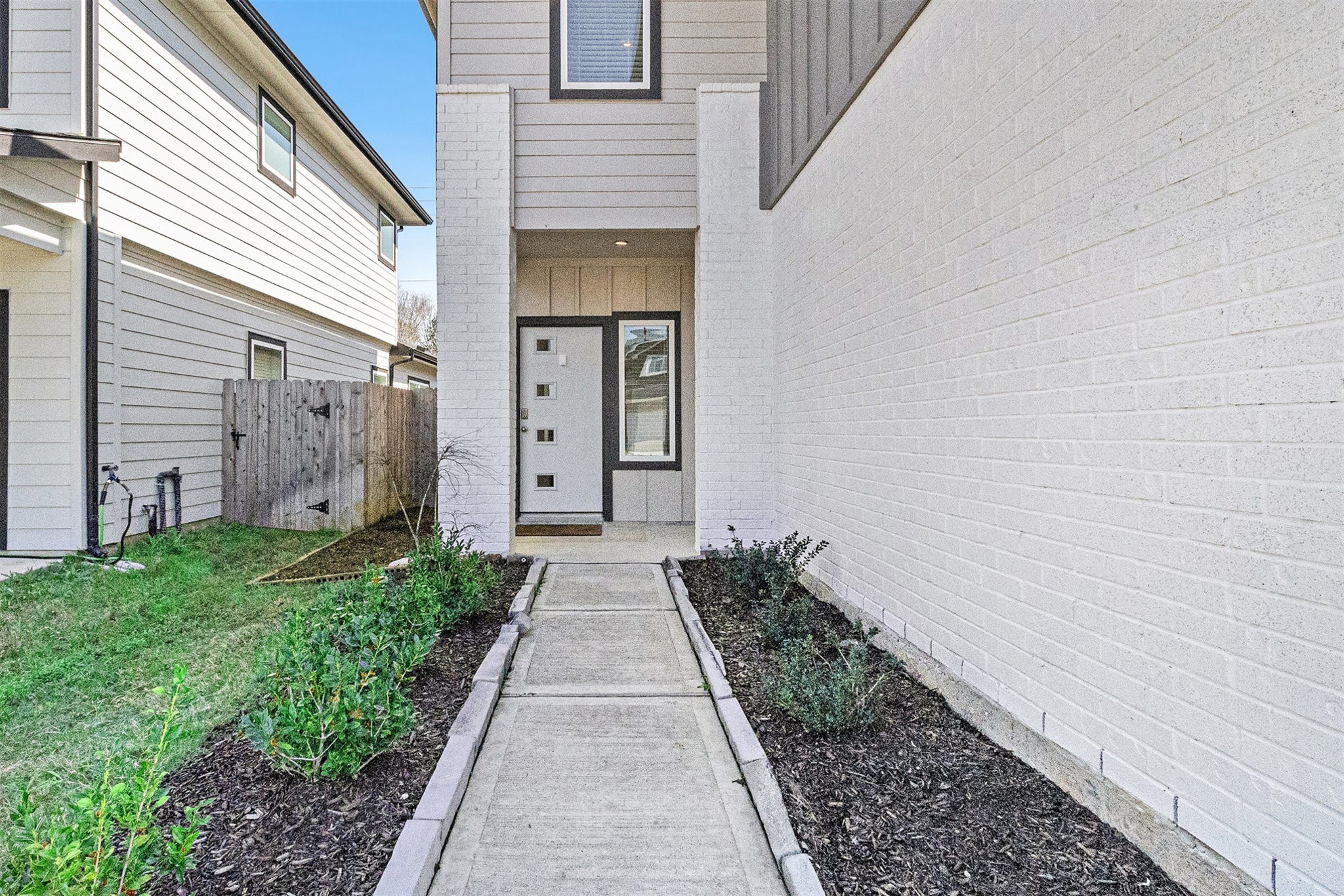 12823 Tokenhouse Lane Houston, TX 77047 - Photo 29 of 37 a pathway of a house with a yard