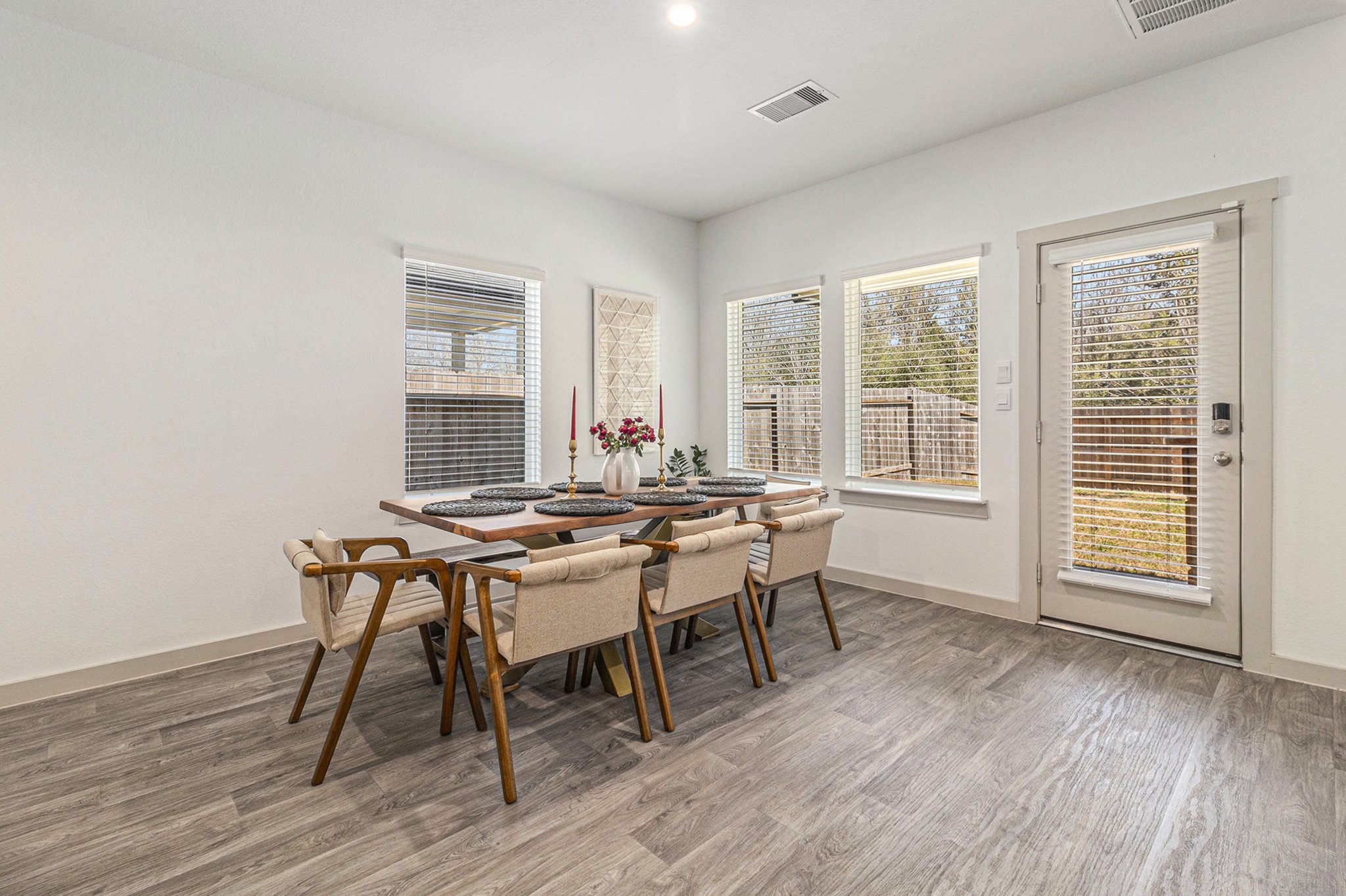 12823 Tokenhouse Lane Houston, TX 77047 - Photo 7 of 37 a view of a dining room with furniture and wooden floor