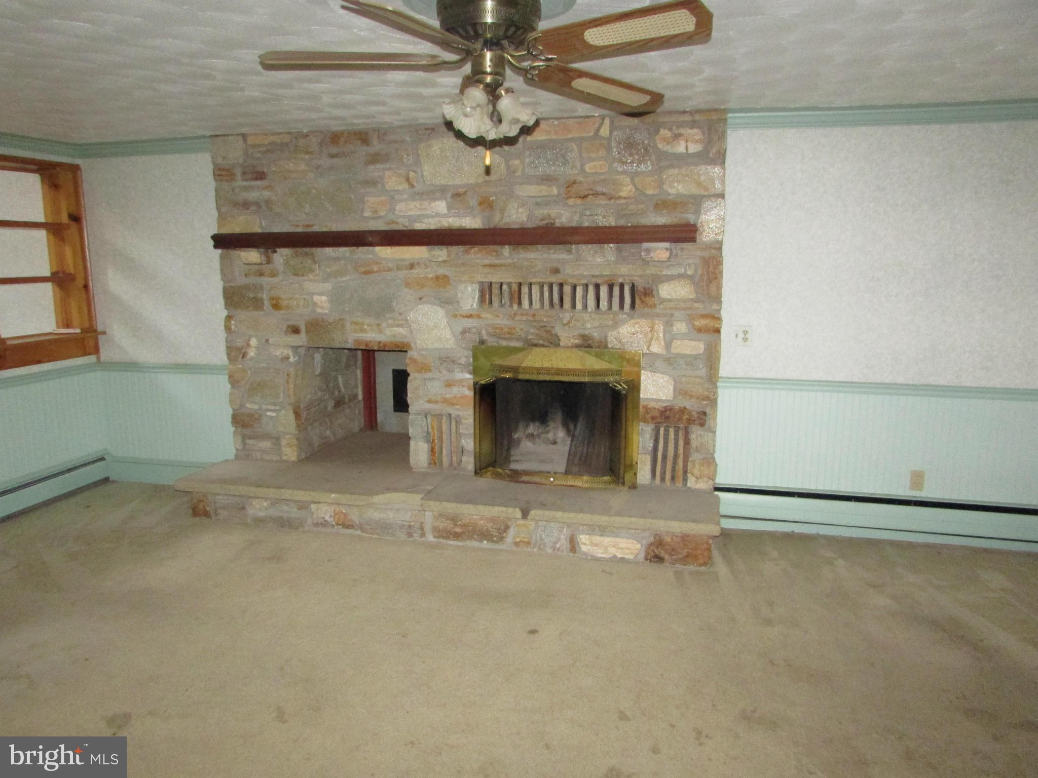 2045 Old Washington Road Westminster, MD 21157 - Photo 8 of 30 Living Room woodburning fireplace
