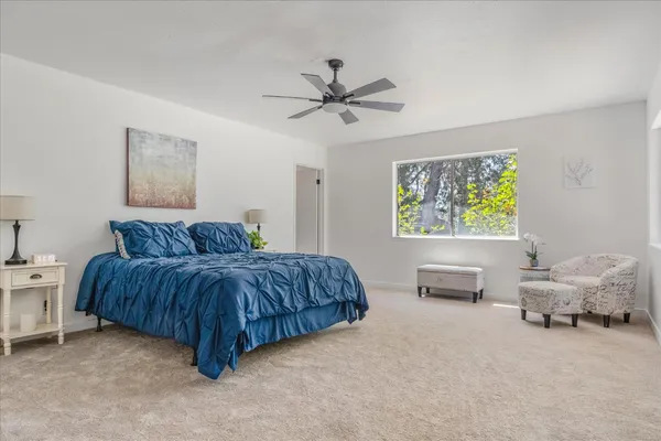 a bedroom with a bed and a table