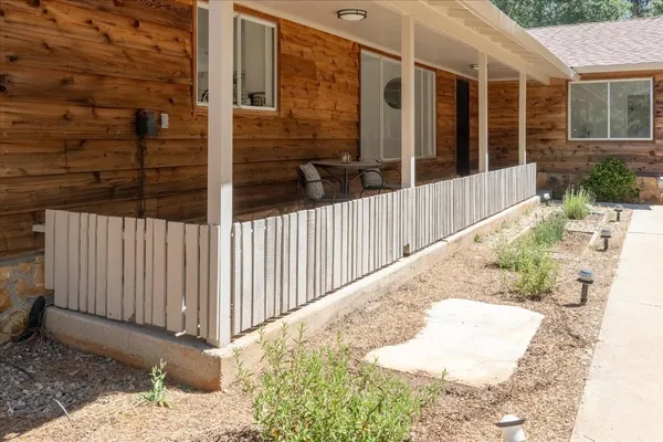 a bathroom with a sink toilet a mirror and shower
