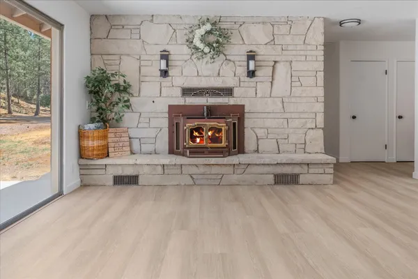a living room with furniture and a fireplace