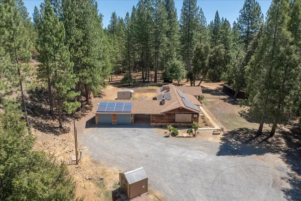 an aerial view of residential house with outdoor space